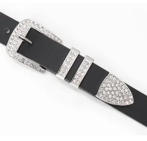 Close-up of black leather belt with sparkling rhinestones on silver buckle and tip