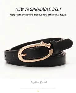 Close-up of black PU leather belt featuring a polished gold bow buckle for women