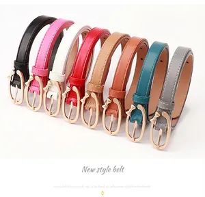 Close-up of slim PU leather belts with decorative alloy bow buckles in eight colors