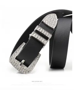 Macro detail of high-shine rhinestones and silver buckle on a black punk leather belt