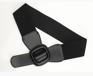 Macro detail of black elastic waist belt featuring litchi grain leather and buckle