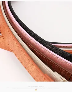 Détail de ceintures en cuir texturé avec surpiqûres élégantes en cinq couleurs variées