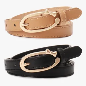 Women's slim PU leather belt with elegant golden bow buckle in black and tan colors