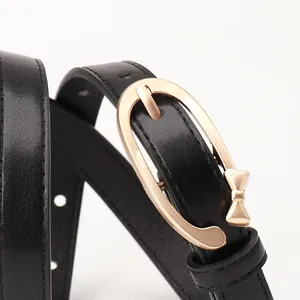 Women's black PU leather belt with elegant golden oval buckle and bow detail