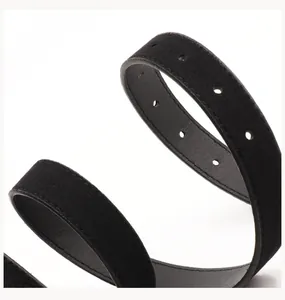 Macro detail of black suede belt showing smooth texture and precise adjustment holes