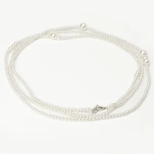 Elegant long white pearl necklace and waist chain with silver lobster clasp detail