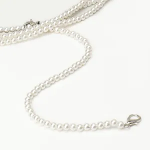 Elegant long French pearl necklace belt with white round pearls and silver lobster clasps