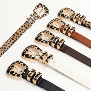 Five assorted leopard print and solid PU leather belts with decorative alloy buckles