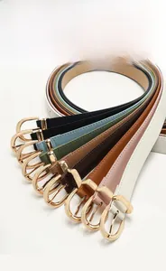 Detailed display of multi-color slim belts with elegant golden D-ring metal buckles