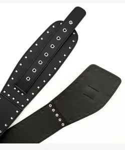 Detail shot of black leather punk belt featuring rows of silver metal studs and eyelets