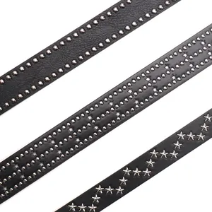 Three punk style black leather belts with silver star rivets and metallic studs on white back