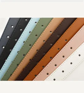 Detailed view of nine colorful minimalist leather belts with sleek stitching and alloy buckles