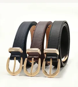 Detailed trio of minimalist leather belts in navy, brown, and black with gold buckles