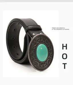 Detailed view of bohemian belt with engraved metal buckle and green turquoise stone inlay
