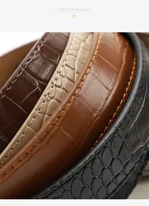 Macro shot of embossed crocodile texture and stitching on colorful retro leather belts
