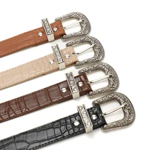 Vintage western belts with embossed crocodile texture and floral engraved silver buckles