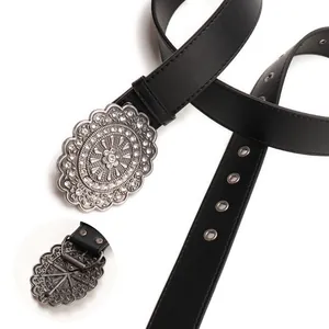 Vintage black leather belt for women featuring a large rhinestone buckle and silver grommets