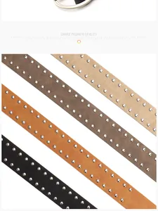 Detail of four colorful punk style belts featuring double rows of silver metal rivets