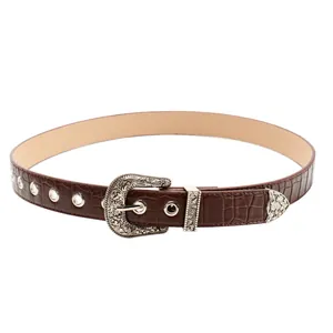 Vintage brown crocodile embossed belt with silver carved buckle and metal tip accents