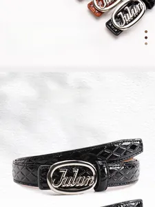 Detail of glossy black quilted PU leather belt with silver oval Julun metal buckle