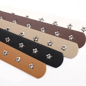 Five assorted vintage faux leather belts with star eyelet studs in multiple colors