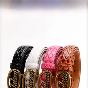 Close-up of four quilted patent leather belts with oval golden lettering buckles