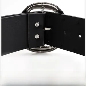 Macro shot of vintage style double rivet belt with polished silver oval buckle