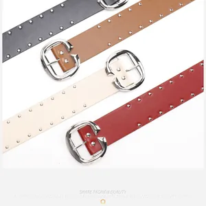Detail view of retro double-row silver rivets on four stylish leather belt colors