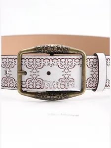 Close-up of white embossed belt with bronze vintage alloy buckle and brown patterns