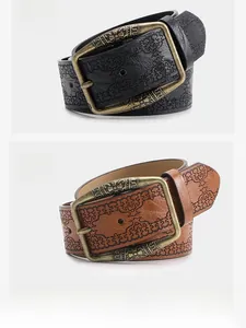 Detail of embossed retro Y2K belts in black, camel, and white with metal buckle