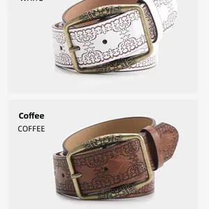 Close-up of embossed vintage leather belts with Western style buckles in white and coffee