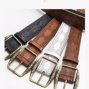 Flat lay display of Y2K vintage embossed leather belts with antique metal buckles in four colors