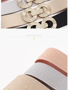Close-up of elastic waist belts in diverse colors with interlocking geometric gold buckles