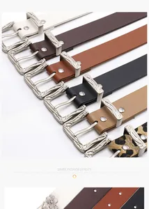 Detail of western style belts with textured silver metal buckles in various colors