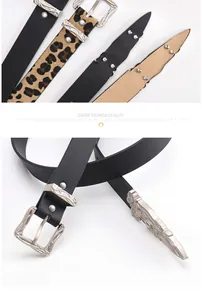 Detailed view of bohemian style metal buckles on black and leopard print belts
