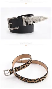 Detail of bohemian black belt with silver relief buckle and leopard print textured belt