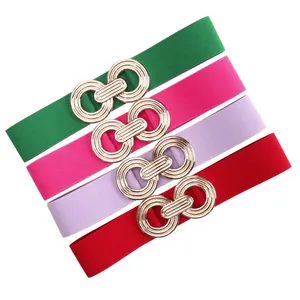 Elastic waist belts with interlocking gold geometric buckles in multiple colors