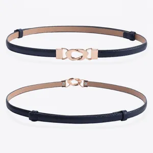 Adjustable navy blue slim leather belt for women with gold twist buckle and white background