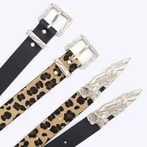 Set of four leopard print and black leather belts featuring vintage silver carved buckles