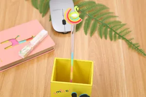Creative flamingo and rainbow cartoon pen set in a yellow wooden smile pencil holder