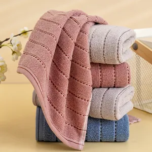 Absorbent pure cotton towel set with textured honeycomb stripes in multiple pastel colors
