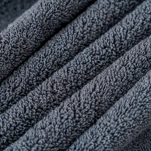 Thick dark gray cotton towel featuring high-density loop weave and soft texture