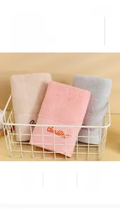 Close-up of three soft long-staple cotton towels with elegant Goodness embroidery detail