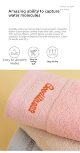 Close-up of thick cotton towel with Goodness embroidery and soft terry texture