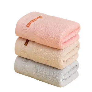 Three-piece set of thick absorbent cotton towels with Goodness embroidery on white background