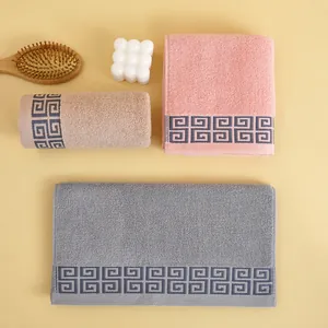 Thick cotton towel set in pink, khaki, and grey with greek key border for bathroom