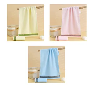 Detailed texture of cotton towels in yellow, pink, and blue with striped edges
