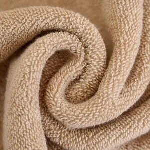 Thick absorbent camel cotton towel with soft terry cloth texture for home use