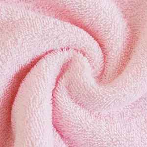 Plush pink 100% cotton towel with soft terry texture and high absorbent loops
