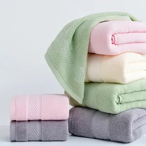 Detail of multi-color cotton towels with honeycomb weave texture and soft terry loops